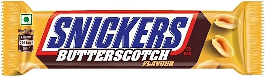 A premium Snickers-Butterscotch chocolate bar wrapper by Exotic Snacks, featuring its logo, peanut images, 200 kcal energy value, and a green vegetarian symbol on a yellow background.