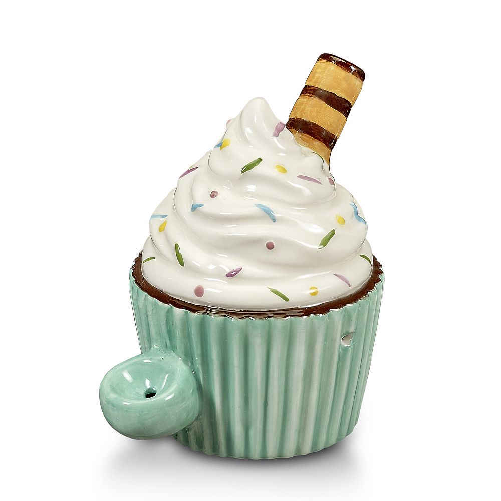 The Fashioncraft Cupcake Pipe is a ceramic pipe shaped like a mug, with a mint green base, white swirled frosting, colorful sprinkles, a striped wafer stick on top, and a matching mint green handle—a cute novelty for any collection.