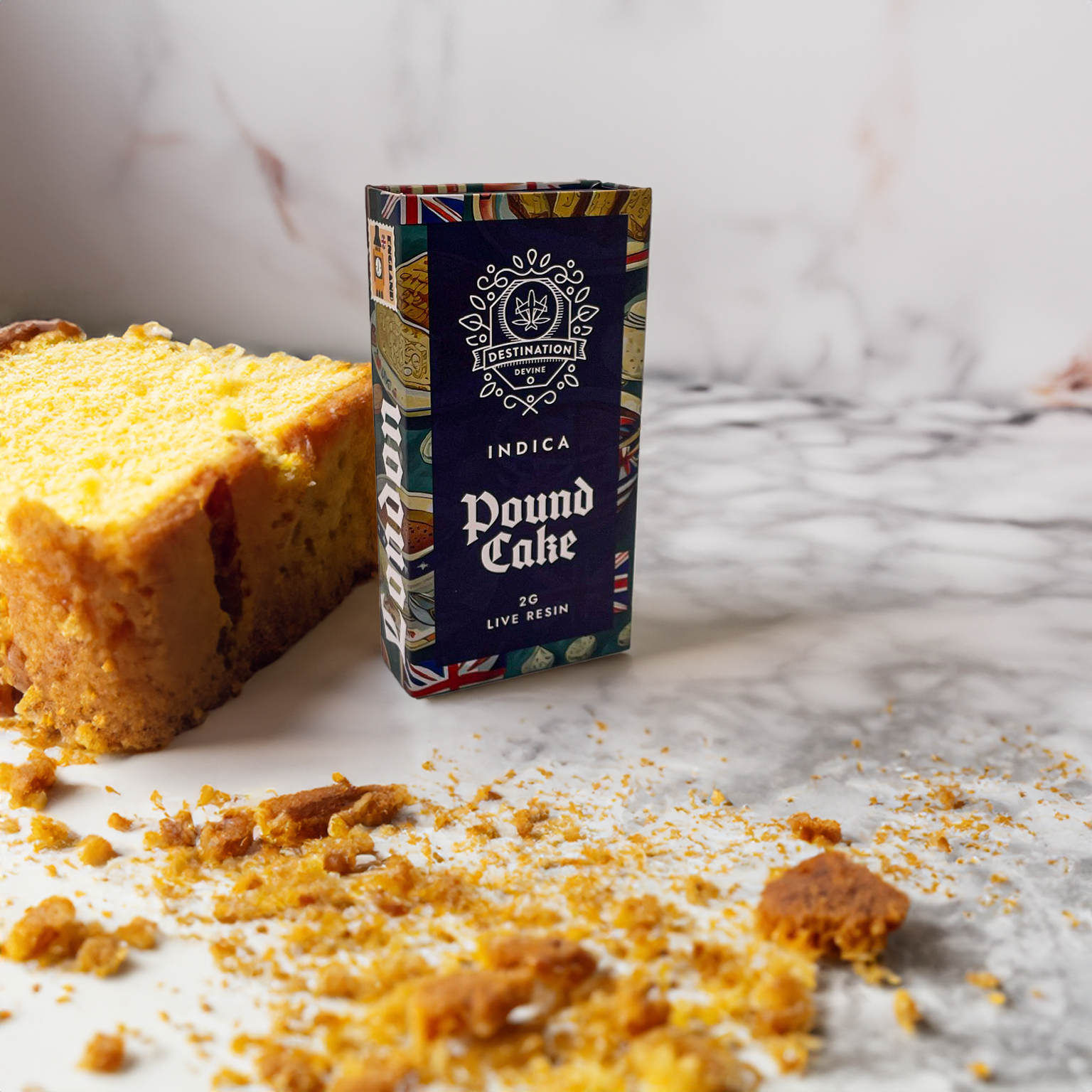 A box labeled deVINE Destinations Live Resin THC Disposable by DeVINE Wellness stands upright on a marble surface next to a slice of yellow pound cake with crumbs—premium cannabis perfect for travel-inspired vaping.