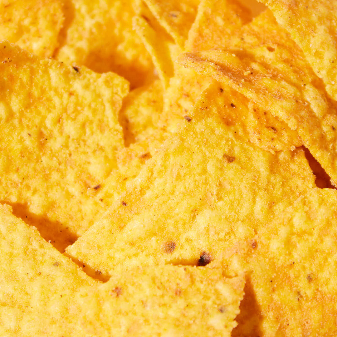 A close-up image of Doritos-Sichuan Chicken by Exotic Snacks, highlighting their yellow, crispy texture and visible seasoning specks.