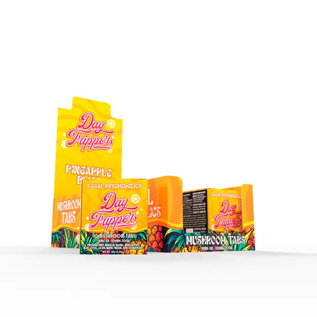 Three vibrant Day Tripper Mushroom Tabs packs by Day Tripper feature tropical fruit graphics and bold Pineapple flavor labeling in yellow, orange, and red tones, highlighting their legal, mood-elevating mushroom formula.