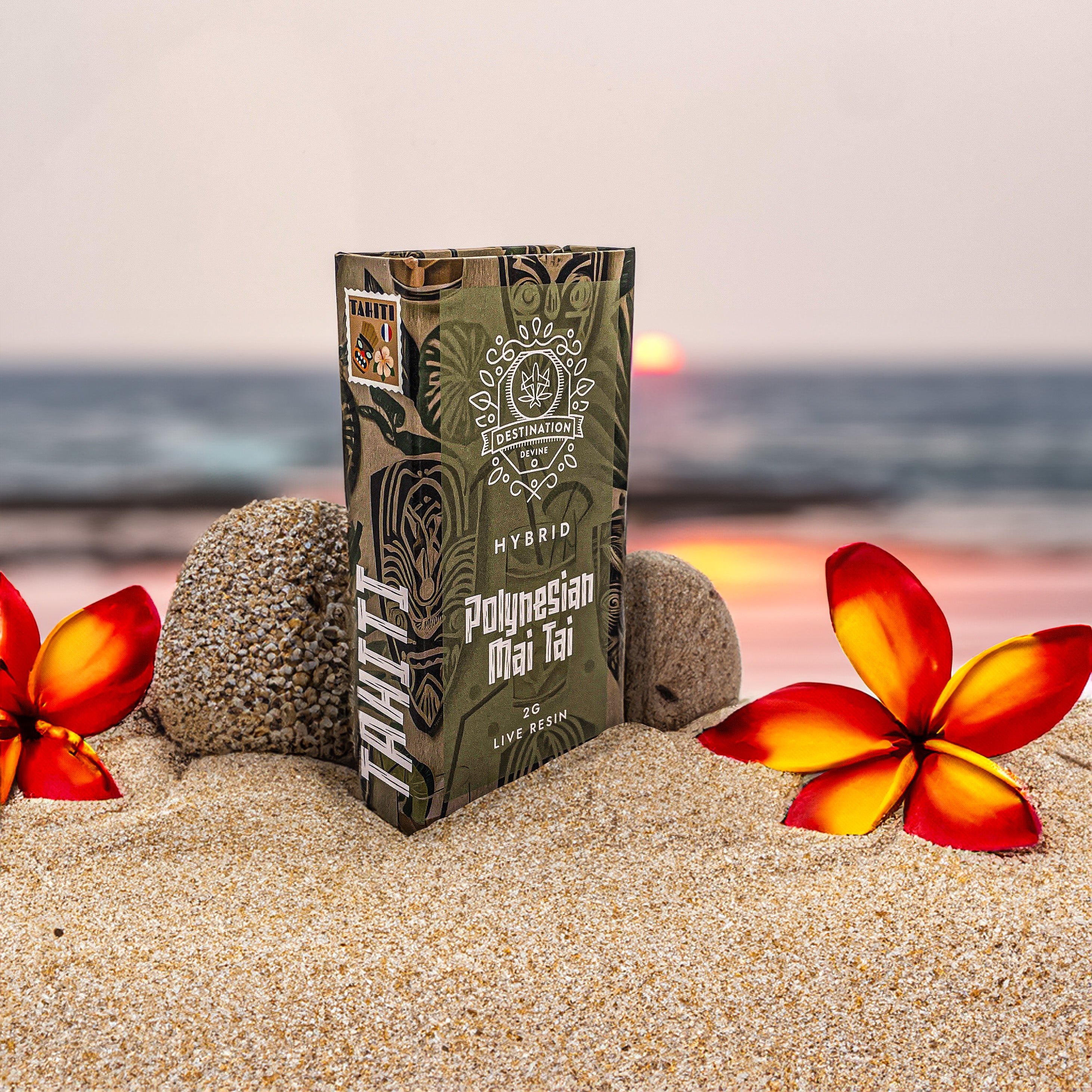 A deVINE Destinations Live Resin THC Disposable by DeVINE Wellness rests on a sandy beach with two red and yellow flowers and smooth stones at sunset—inviting you to a travel-inspired vaping experience.