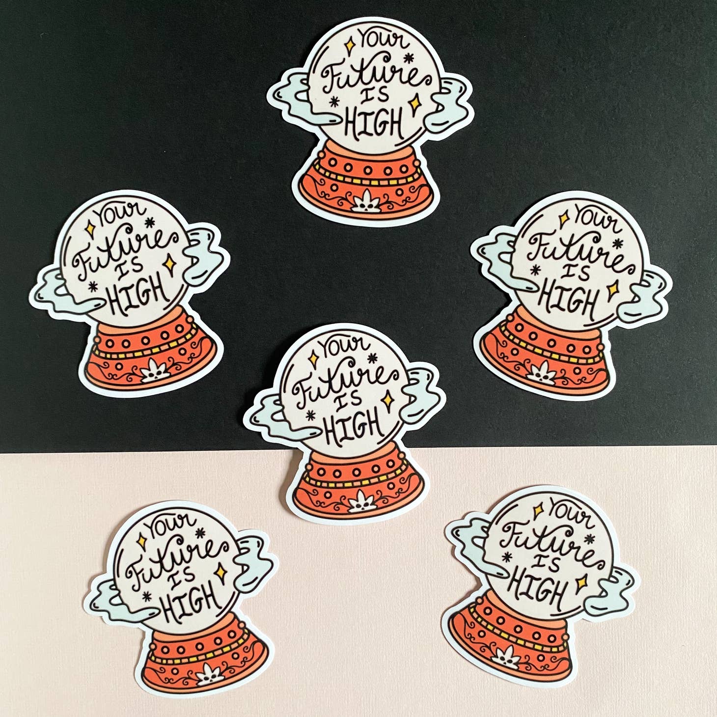 The Han Made Your Future Is High Sticker features a waterproof crystal ball design with orange base, white top, handwritten message, stars, and leaves—perfect for laptops. Set of six on a black and pale pink background.