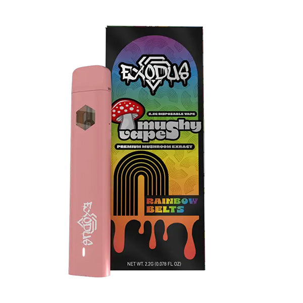 A pink Exodus Mushy Vape device labeled Exodia is displayed with its vibrant box, which reads Mushy Belts Premium Mushroom Extract Rainbow Belts and features colorful rainbow and mushroom graphics.