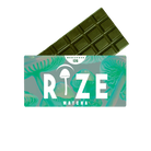 A green Rize 12G Mushroom Chocolate Bar is partially wrapped in packaging labeled RIZE, featuring psychedelic mushroom illustrations on a turquoise background.
