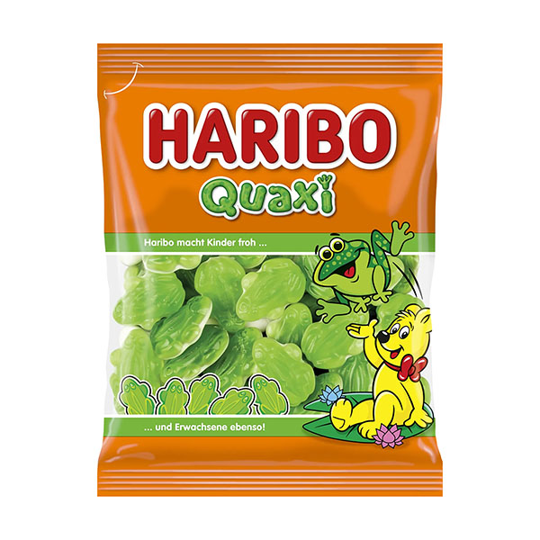 Exotic Snacks Haribo Quaxi Gummies are green, frog-shaped fruit candies in orange packaging with cartoon frogs and German text—ideal for fans of marshmallow treats and Haribo Frogs.