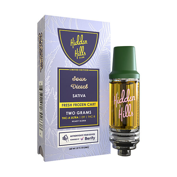 A Hidden Hills Fresh Frozen THC Cartridge vape with amber liquid, shown in a purple box featuring “Fresh Frozen Cart,” “Two Grams,” and THC-A Ultra details on its packaging.
