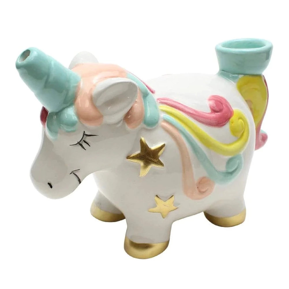 The Unicorn Pipe by Fashioncraft is a ceramic novelty pipe with a pastel rainbow mane, gold hooves, stars on its side, and closed eyes. It features two openings: one on the back and one at the tip of the horn.