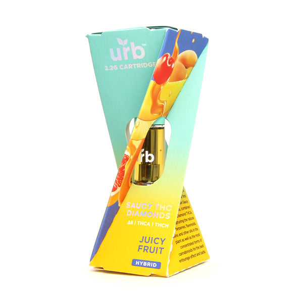 A triangular, colorful box labeled URB displays a Saucy Diamonds Cartridge with fruit graphics. The text reads URB Saucy Diamonds Cartridge, featuring premium terpenes and Liquid Diamond THCA for a flavorful hybrid experience.