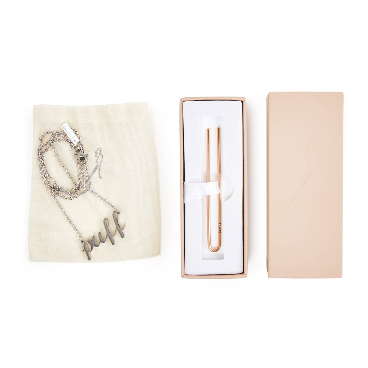 The NECKLACE + CLIP SET by Frankie Smoke features a silver cannabis necklace with a puff pendant on a cream cloth bag, beside a rose gold roach clip smoking accessory in a white and pink box.