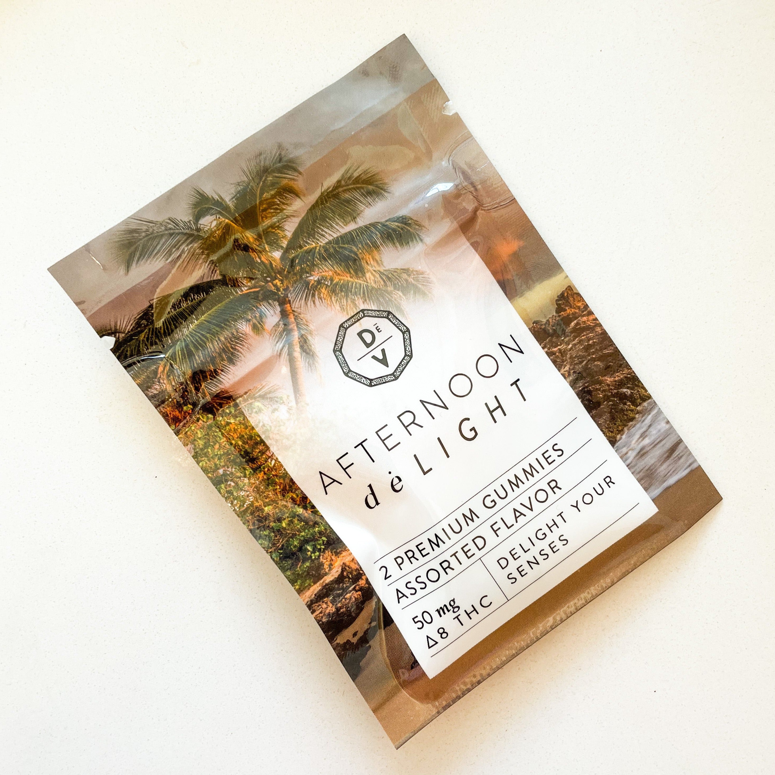 Afternoon deLIGHT ∆8 Gummies package with palm tree design, assorted flavor, 50mg Δ8 THC, premium hemp distillate gummies.